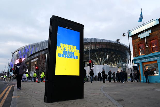 An advertising board displays a message of solidarity for the people of Ukraine outside Tottenham Hotspur Stadium. (Photo by Shaun Botterill/Getty Images)