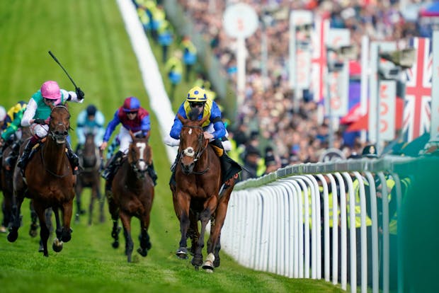 Richard Kingscote riding Desert Crown to victory in the Epsom Derby on June 4, 2022 (by Alan Crowhurst/Getty Images)