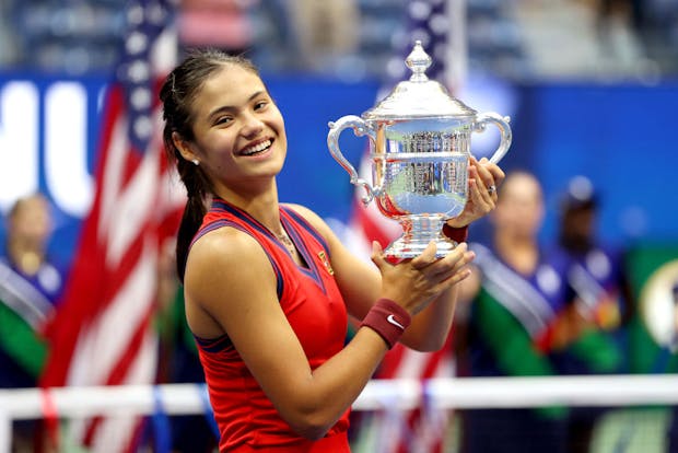 Emma Raducanu celebrates with the championship trophy after defeating Leylah Fernandez during their women's singles final at the 2021 US Open (by Elsa/Getty Images)
