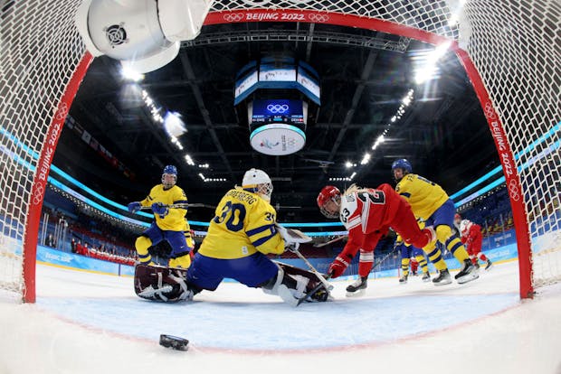 Julie Oksbjerg, #23 of Team Denmark, scores a goal during the Women's Preliminary Round Group B match against Team Sweden at the 2022 Winter Olympics (by Song Yanhua - Pool/Getty Images)