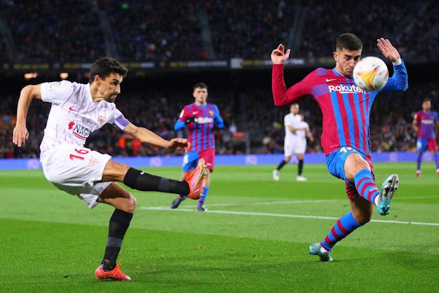 Jesus Navas Gonzalez of Sevilla challenges for the ball against Ferran Torres of Barcelona during LaLiga match (by Eric Alonso/Getty Images)