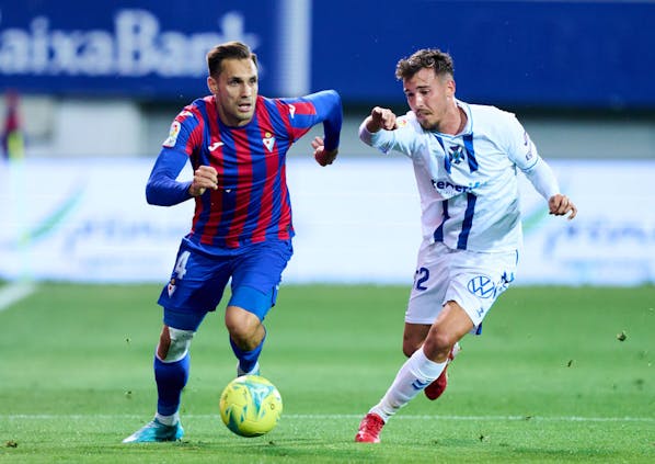 Rober Correa of Eibar duels for ball with Sergio Gonzalez of Tenerife during Segunda Division match on May 21, 2022 (by Juan Manuel Serrano Arce/Getty Images)