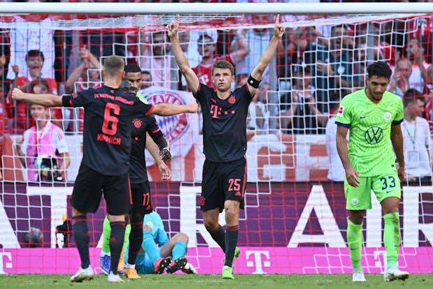 Thomas Mueller of Bayern Munich (C) celebrates after scoring during Bundesliga match against VfL Wolfsburg (by Markus Gilliar - GES Sportfoto/Getty Images)