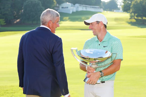 Rory McIlroy (right) chats with PGA Tour commissioner Jay Monahan after winning the Tour Championship (Credit: Getty Images)