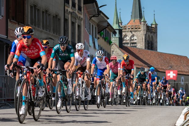 The peloton crosses the town of Romont during the 75th Tour De Romandie (Photo by RvS.Media/Basile Barbey/Getty Images)