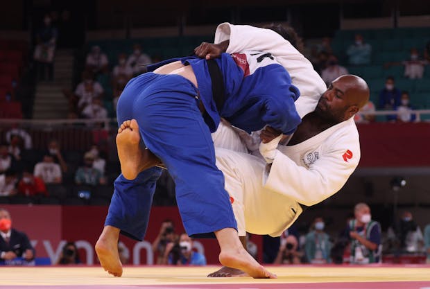 Teddy Riner of Team France and Hisayoshi Harasawa of Team Japan in action during the Tokyo 2020 Olympic Games (by Chris Graythen/Getty Images)