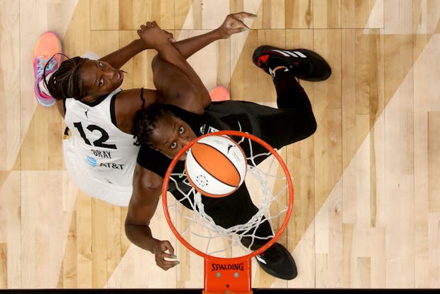 Recent playoff action from the Women's National Basketball Association. (Photo by Steph Chambers/Getty Images)