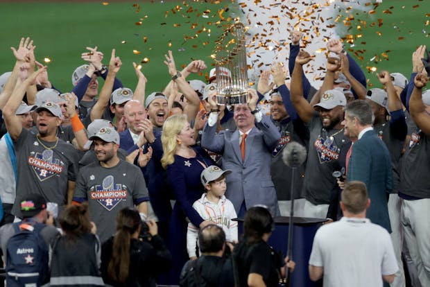Jim Crane, owner of Major League Baseball's Houston Astros (c), celebrates winning the 2022 World Series. (Photo by Rob Carr/Getty Images)