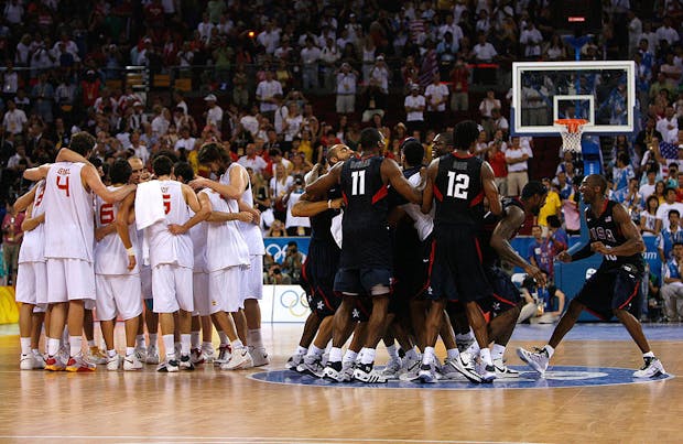 Kobe Bryant #10 joins his US teammates as they celebrate defeating Spain in Beijing 2008 gold medal match (Photo by Harry How/Getty Images)