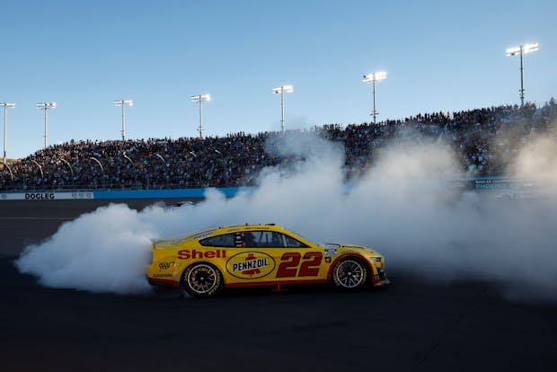 Joey Logano celebrates with a burnout after winning the 2022 NASCAR Cup Series Championship. (Getty Images)