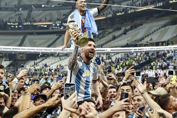 Lionel Messi of Argentina holding the World Cup trophy. (Getty Images)