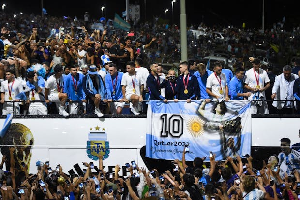 Argentina players wave to fans during fan parade after winning the 2022 FIFA World Cup (Photo by Rodrigo Valle/Getty Images)