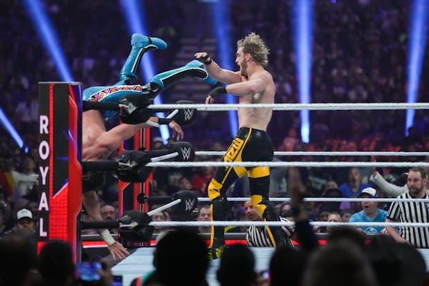 Logan Paul throws Seth Rollins out of the ring during the WWE Royal Rumble (Photo by Alex Bierens de Haan/Getty Images)