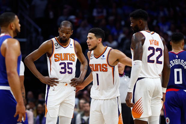 Kevin Durant #35, Devin Booker #1, and Deandre Ayton #22 of the Phoenix Suns during the 2023 NBA Playoffs (Getty Images)