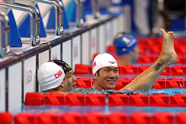 Yuan Weiyi, Tao Zheng and Wang Lichao celebrate after sweeping the medals for Team China at Tokyo 2020 Paralympics (by Dean Mouhtaropoulos/Getty Images)