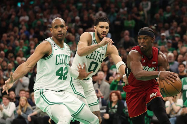 Jimmy Butler of the Miami Heat drives around Jayson Tatum and Al Horford of the Boston Celtics during the 2023 Eastern Conference Finals (Adam Glanzman/Getty)