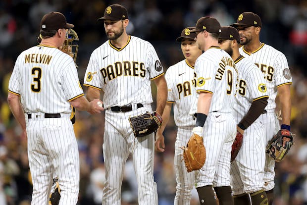 San Diego Padres manager Bob Melvin takes Michael Wacha #52 out of the game as Jake Cronenworth #9, Ha-Seong Kim #7, Xander Bogaerts #2, and Rougned Odor #24 of the  Padres look on (Getty Images)