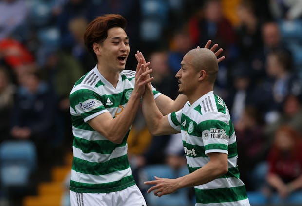 Yuki Kobayashi congratulates Daizen Maeda of Celtic after scoring during the Cinch Scottish Premiership match v Kilmarnock FC. (Photo by Ian MacNicol/Getty Images)