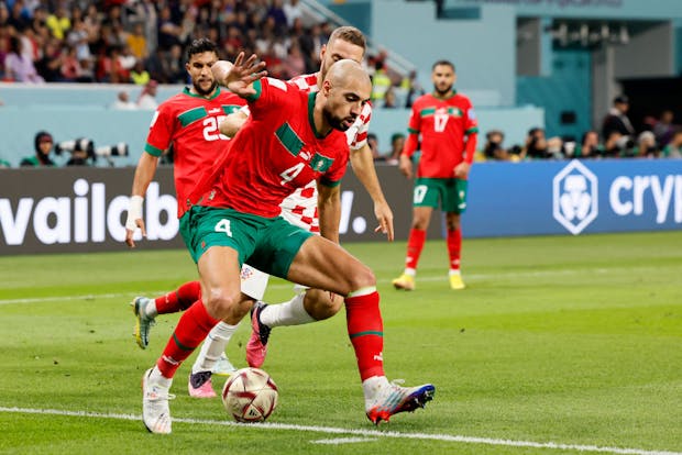 Sofyan Amrabat of Morocco and Nikola Vlasic of Croatia challenge during the 2022 Fifa World Cup third place match (by Richard Sellers/Getty Images)