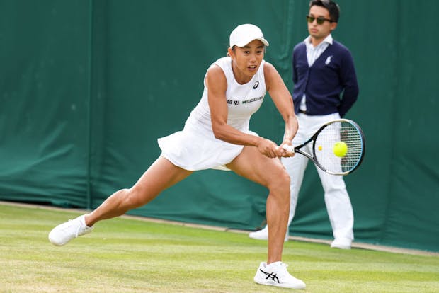 Shuai Zhang of China plays a backhand in the Wimbledon women's singles third round match against Caroline Garcia of France (Photo by Shi Tang/Getty Images)