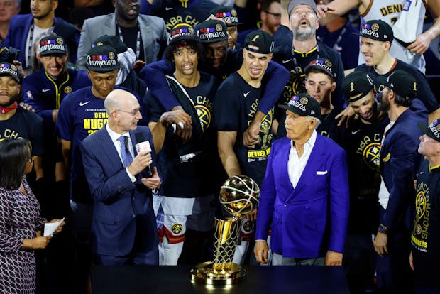 NBA Commissioner Adam Silver presents the Larry O'Brien Championship Trophy to Denver Nuggets owner Stan Kroenke after the 94-89 victory against the Miami Heat in Game Five of the 2023 NBA Finals to win the NBA Championship at Ball Arena on June 12, 2023 in Denver, Colorado. (Photo by Justin Edmonds/Getty Images)