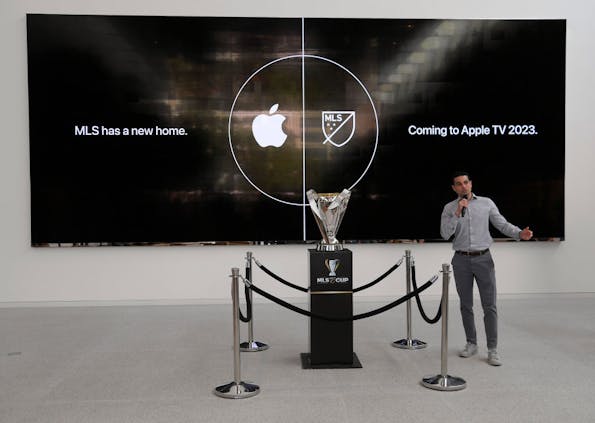 Former Philadelphia Union player and MLS great Morgan Langley speaks next to the MLS Cup trophy at the Apple retail store (Photo by Kevork Djansezian/Getty Images)