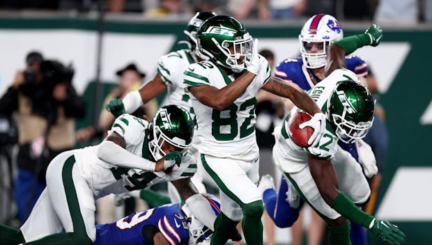 EAST RUTHERFORD, NEW JERSEY - SEPTEMBER 11: Wide receiver Xavier Gipson #82 of the New York Jets scores the game winning touchdown on a 65-yard punt return during the overtime quarter of the NFL game against the Buffalo Bills at MetLife Stadium on September 11, 2023 in East Rutherford, New Jersey. The Jets defeated the Bills 22-16 in overtime.