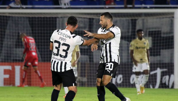 Antonio Bareiro of Paraguayan Primera División club Libertad celebrates with teammate Ivan Piris after scoring during a Copa Libertadores match versus Atletico Mineiro on June 27, 2023