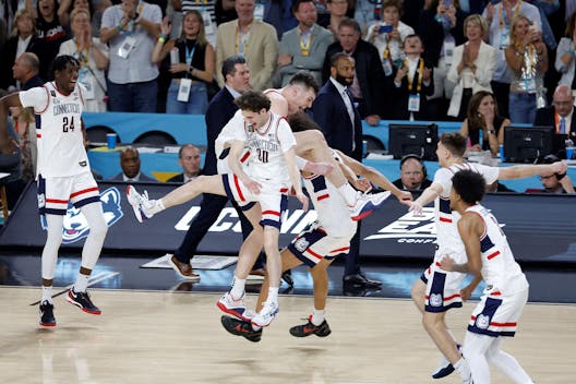 GLENDALE, ARIZONA - APRIL 08: The Connecticut Huskies celebrate after beating the Purdue Boilermakers 75-60 to win the NCAA Men's Basketball Tournament National Championship game at State Farm Stadium on April 08, 2024 in Glendale, Arizona. (Photo by Chris Coduto/Getty Images)