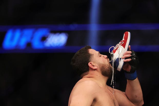 Tai Tuivasa drinking beer from his shoe. (Photo by Carmen Mandato/Getty Images)