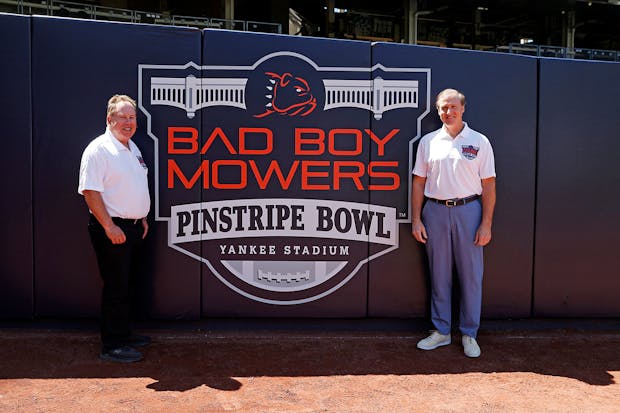 Mark Holtzman, executive director of the Bad Boy Mowers Pinstripe Bowl (l), with Peter Ballantyne, Bad Boy Mowers chief executive. (New York Yankees)