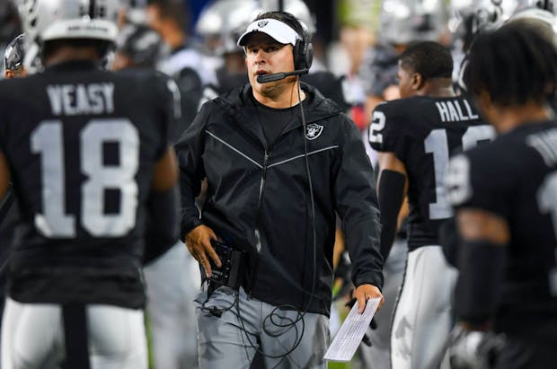  Head coach Josh McDaniels of the Las Vegas Raiders looks on during the first half of the 2022 Pro Hall of Fame Game against the Jacksonville Jaguars at Tom Benson Hall of Fame Stadium on August 04, 2022 in Canton, Ohio. (Credit: Getty Images)