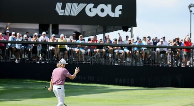 Cameron Smith of Australia waves to the crowd on the third hole during the final round of the LIV Golf Invitational in Boston. (Photo by Andy Lyons/Getty Images).