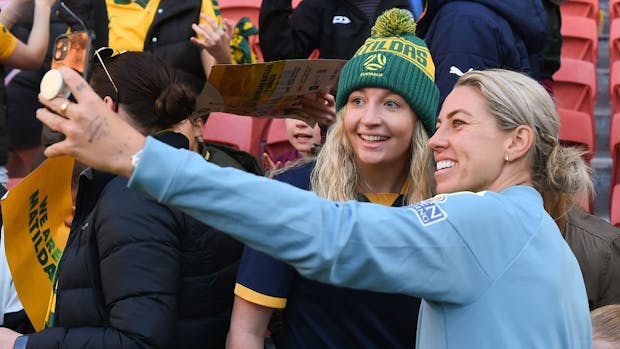 Matilda's defender and Cadbury Ambassador Alanna Kennedy takes selfies with fans before a match in September, 2022. (Photo by Albert Perez/Getty Images)
