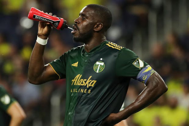NASHVILLE, TENNESSEE - JULY 03: Larrys Mabiala #33 of Portland Timbers drinks water during a substitution against Nashville SC at GEODIS Park on July 03, 2022 in Nashville, Tennessee. (Photo by Johnnie Izquierdo/Getty Images)