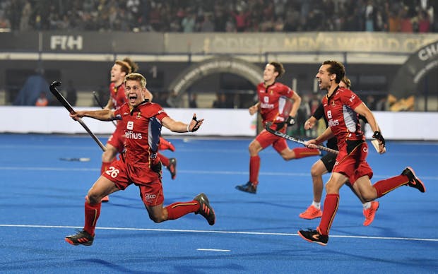 The Belgium side celebrate after winning via a penalty shootout during the FIH Men's Hockey World Cup final (Photo by Charles McQuillan/Getty Images for FIH)