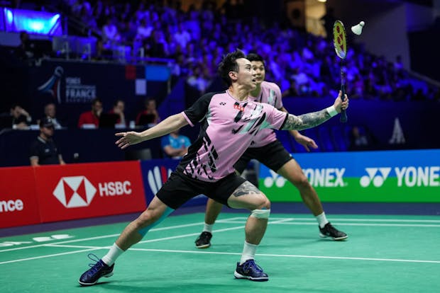Lu Ching Yao (back) and Yang Po Han of Chinese Taipei compete in the men's doubles final match of the 2022 Yonex French Open (by Shi Tang/Getty Images)