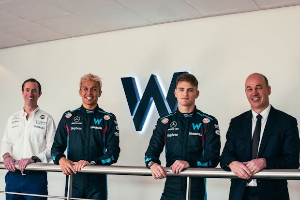 (l-r) Williams Racing drivers Alex Albon and Logan Sargeant, with Williams Racing board member James Matthews (left) and Gulf Oil CEO Mike Jones (right)