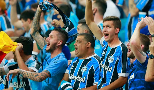 Fans of Grêmio gesture before the match against Sao Paulo (Photo by Silvio Avila/Getty Images)
