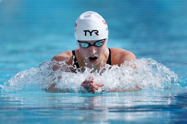 Katie Ledecky swimming in a TYR suit and cap (Getty Images)