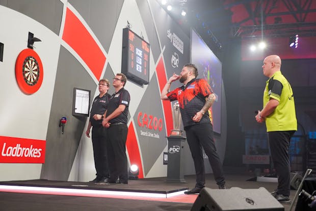 Michael Smith of England and Michael van Gerwen of the Netherlands during the Cazoo World Darts Championship (Photo by Pieter Verbeek/BSR Agency/Getty Images)