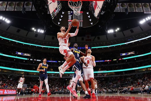 CHICAGO, ILLINOIS - OCTOBER 12: Zach LaVine #8 of the Chicago Bulls goes up for a layup against the Denver Nuggets during the second half at the United Center on October 12, 2023 in Chicago, Illinois. NOTE TO USER: User expressly acknowledges and agrees that, by downloading and or using this photograph, User is consenting to the terms and conditions of the Getty Images License Ag