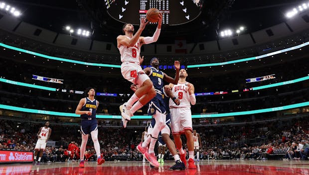 CHICAGO, ILLINOIS - OCTOBER 12: Zach LaVine #8 of the Chicago Bulls goes up for a layup against the Denver Nuggets during the second half at the United Center on October 12, 2023 in Chicago, Illinois. NOTE TO USER: User expressly acknowledges and agrees that, by downloading and or using this photograph, User is consenting to the terms and conditions of the Getty Images License Ag