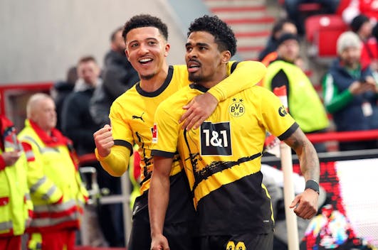 BERLIN, GERMANY - MARCH 2: Ian Maatsen of Borussia Dortmund (R) celebrates with teammate Jadon Sancho after scoring his teams second goal during the Bundesliga match between 1. FC Union Berlin and Borussia Dortmund at An der Alten Foersterei on March 2, 2024 in Berlin, Germany. (Photo by Sebastian El-Saqqa - firo sportphoto/Getty Images)